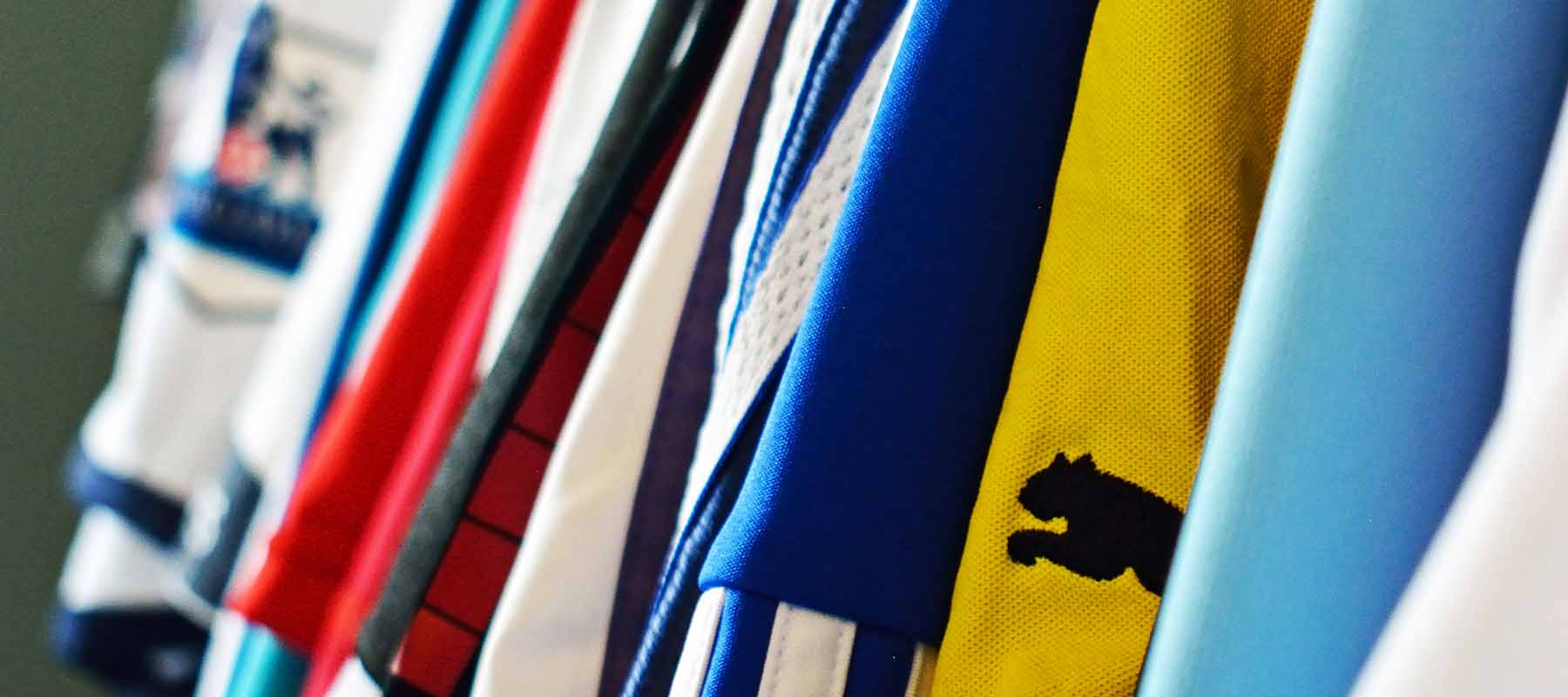 Clothes rail full of football shirts